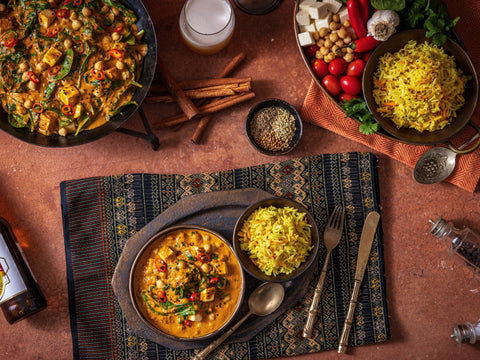Culinary scene with dishes of food on a textured surface